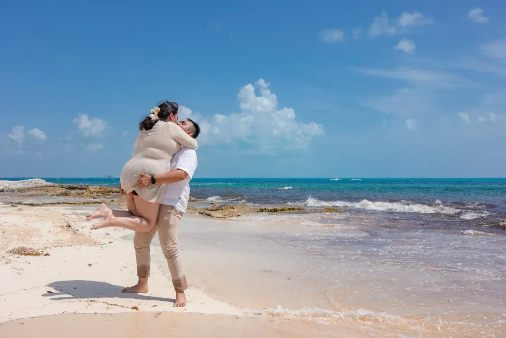 Cancun Engagement Photographer capturing a surprise proposal and engagement session at Caracol Beach in Cancun with an emotional couple at sunset.