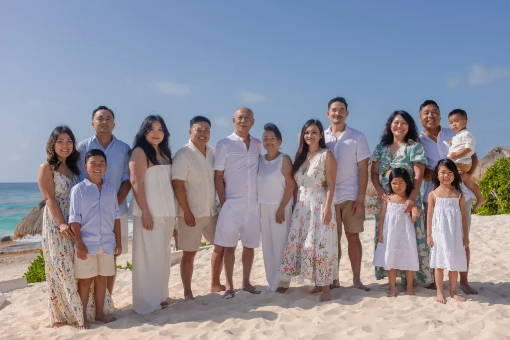 Cancun family photographer capturing a multi-generational family session and beach maternity portraits at Playa Delfines.