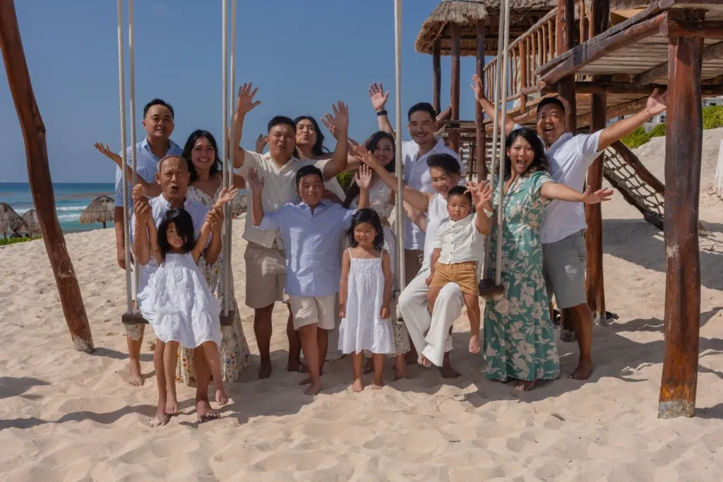 Cancun family photographer capturing a multi-generational family session and beach maternity portraits at Playa Delfines.