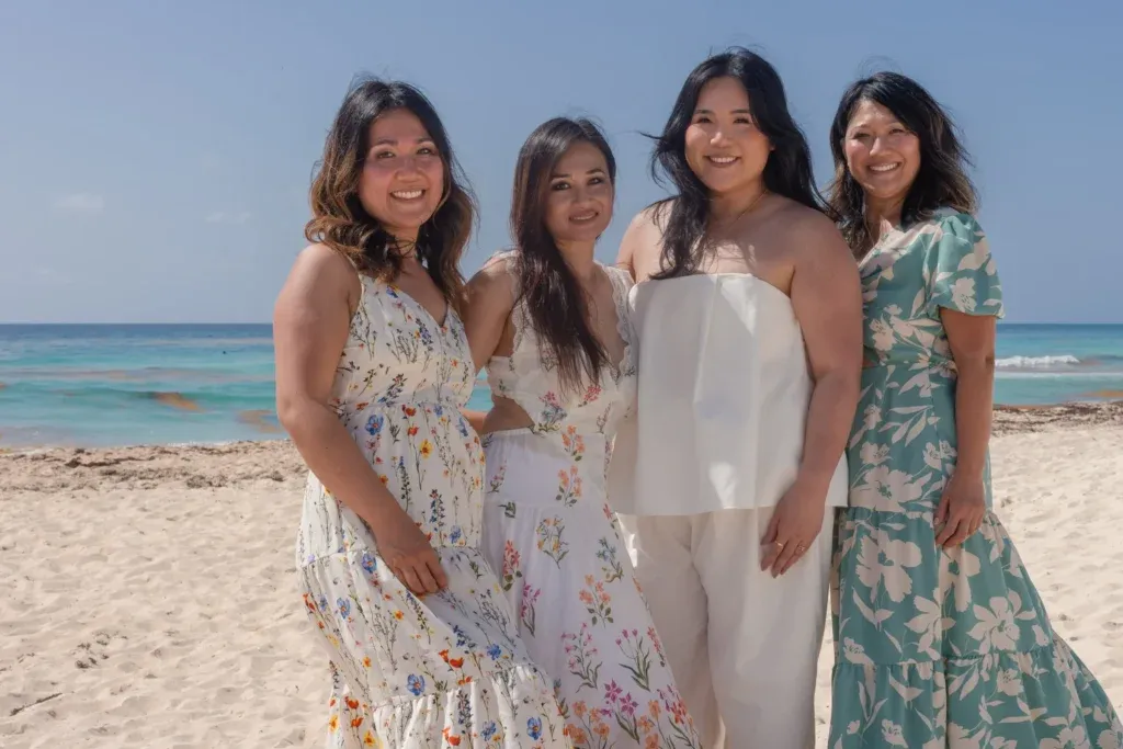 Cancun family photographer capturing a multi-generational family session and beach maternity portraits at Playa Delfines.
