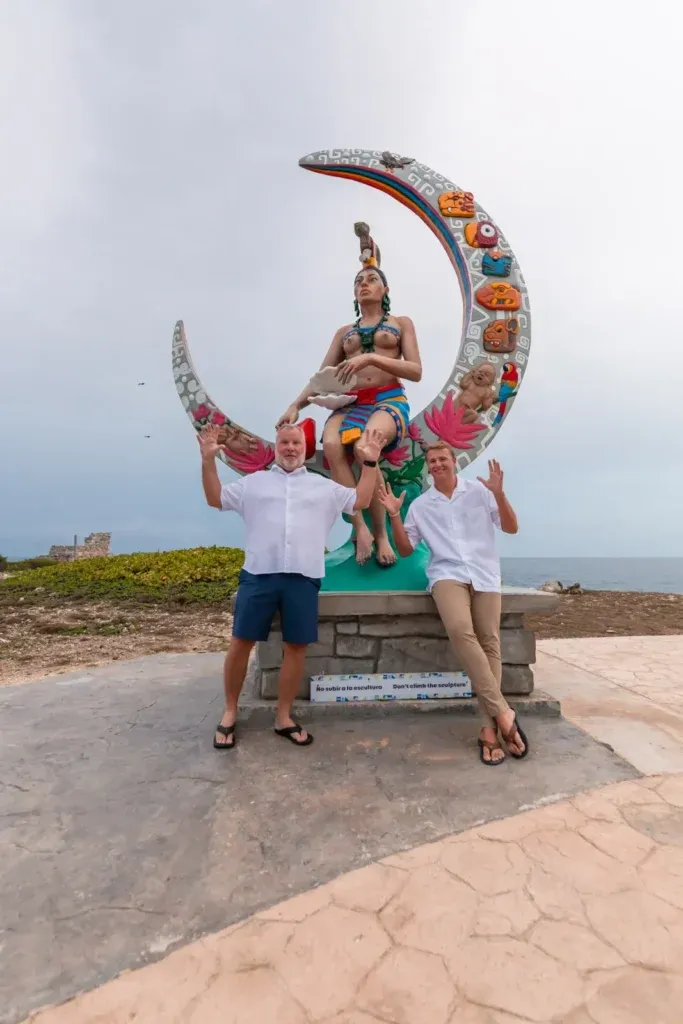 Couple celebrating engagement proposal at Punta Sur cliffs in Isla Mujeres Mexico.