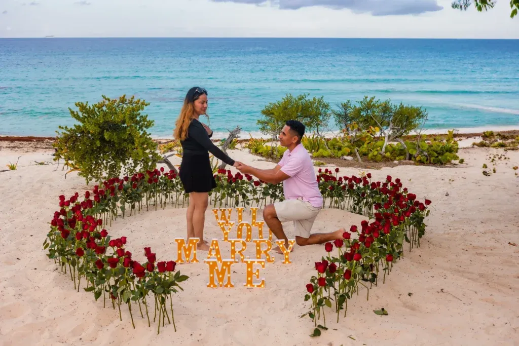 Cancun Engagement Photographer capturing a surprise marriage proposal at Playa Delfines in Cancun