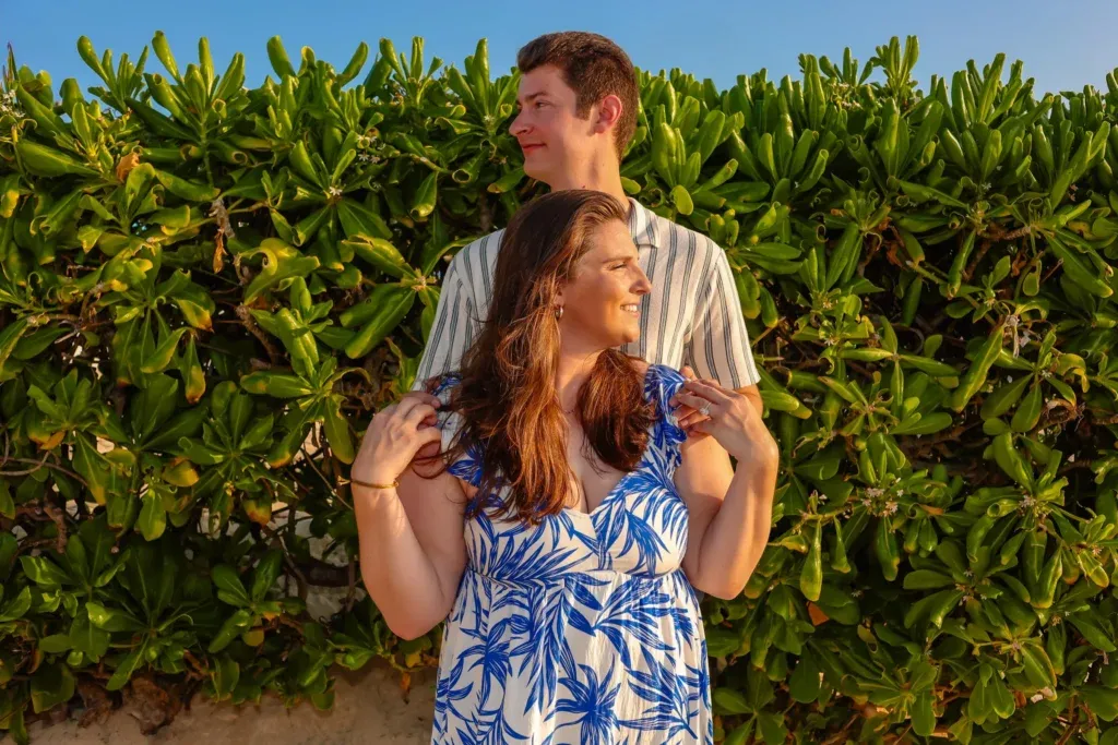 Cancun engagement photographer capturing a romantic sunrise proposal recreation at Playa Delfines.