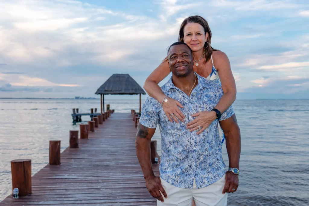 Cancun family photography session capturing Will’s 50th birthday celebration at sunset on Langosta Beach.