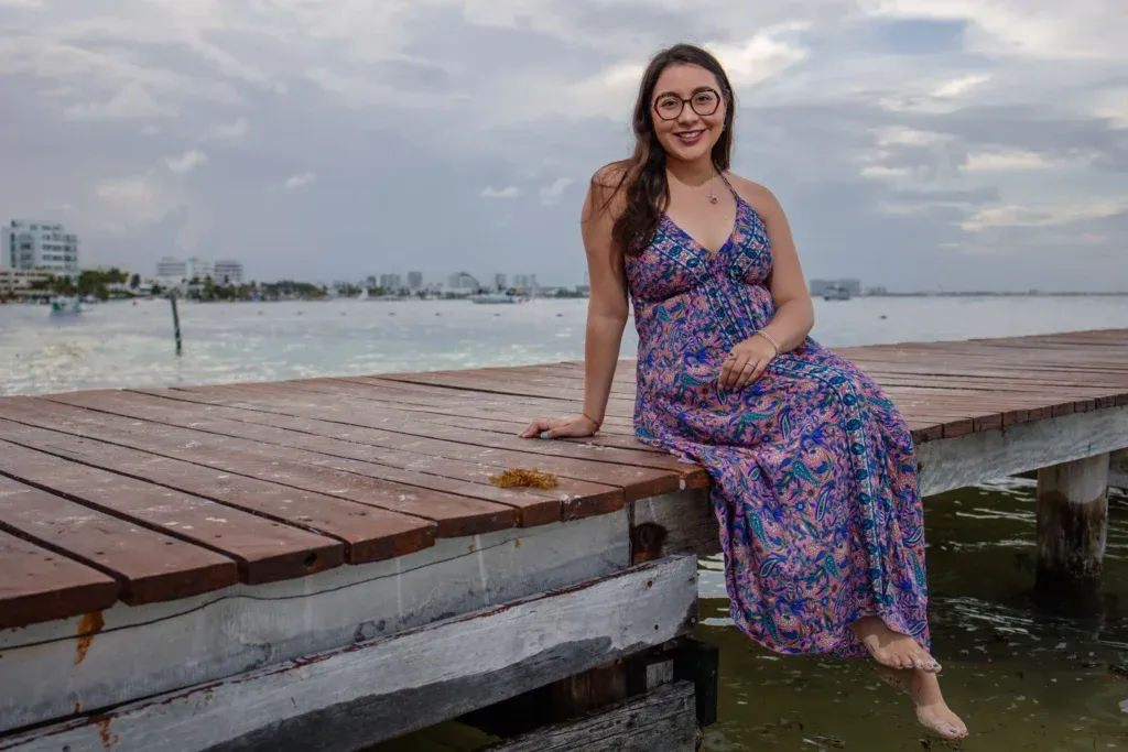 Cancun family photographer capturing a sunset family session on the beach at The Royal Cancun near Playa Langosta