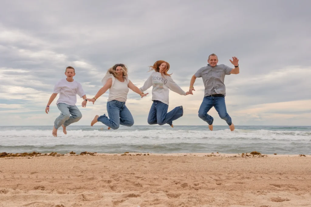 Cancun Family Photographer capturing family beach portraits of Jen and her family at Playa Delfines in Cancun, Mexico.