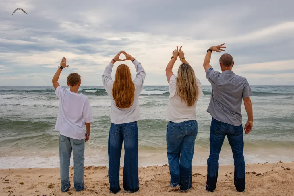 Cancun Family Photographer capturing family beach portraits of Jen and her family at Playa Delfines in Cancun, Mexico.